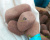 Щебень галтованный малиновый (песчаник) фр. 20-70 мм. фото 